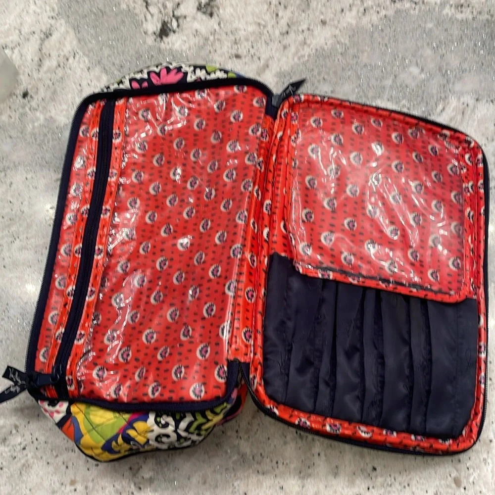 Vera Bradley travel toiletry bag with brush compartments.